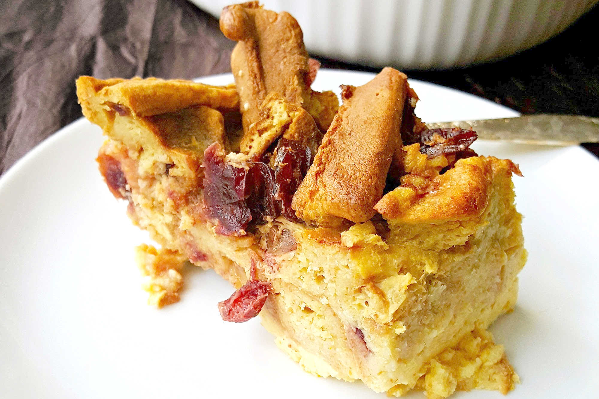 Indulge in the ultimate comfort dessert with our Orange Craisin Waffle Bread Pudding. Each bite is like a warm hug for your taste buds.  #holidaytreat #easyrecipe #CranberryCravings #BreakfastDessert #HolidaySweets #BakerySpecialties #BreadPuddingDelights #DessertObsession #BreadPuddingLove #SweetToothSatisfied #WafflePuddingPerfection #CraisinCraze #BreadPuddingHeaven #dessertupgrade #treatyourself #wafflecrush
