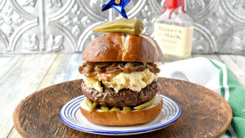 Kentucky Burger with Bourbon Onions and Pimento Beer Cheese is an homage to my family and childhood memories.  From the pimento cheese combined with beer cheese to the bourbon onions and pickled okra topping everything on this burger reminds me of home.