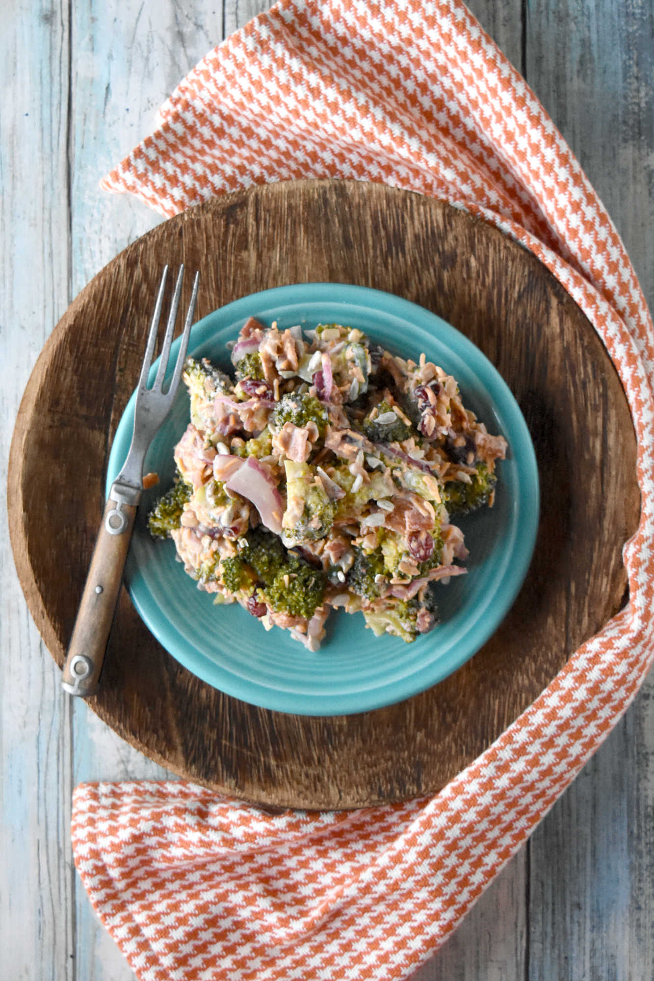 Skip the boring side salads and try this Creamy Broccoli Salad instead! Bursting with flavor and nutrients, it's the perfect accompaniment to any holiday meal. #healthyeating #creamysalad #cleaneating #broccolisalad #SaladLoversUnite #VeggieDelight  #EatYourGreens #holidaysidedish #sidedishrecipe #sidesalad
