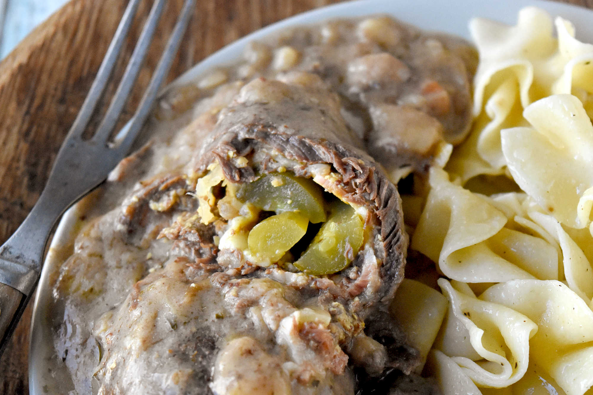 Sink your teeth into a hearty and savory meal with our German Style Beef Rouladen. Perfectly seasoned beef, rolled and simmered in a rich gravy is a hearty crowd-pleasing dinner. #GermanFoodieFriday #BeefRouladen #AuthenticFlavors #MeatLoversUnite #GermanFoodLove #RouladenRecipe #SavorTheFlavors #HomemadeEats #GermanCooking #ComfortFood #GermanDelicacy #RouladenLove #GermanFood #BeefRouladen #Foodie